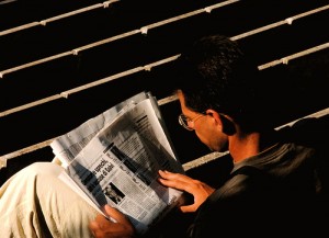 man reading news