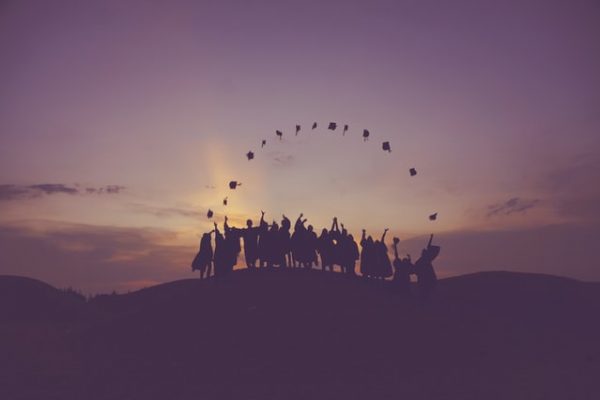 image of graduates throwing caps